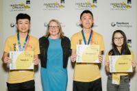T.J. Lu, Barnabas Lu, and Michelle Li of Team UltraVii with Lucie Howell, Chief Learning Officer of The Henry Ford Museum of American Innovation at the 2022 Raytheon Technologies Invention Convention U.S. Nationals held at the museum in spring.