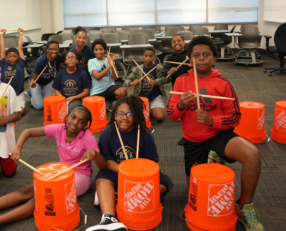 Horizons at Georgia Tech scholars playing with percussion instruments.