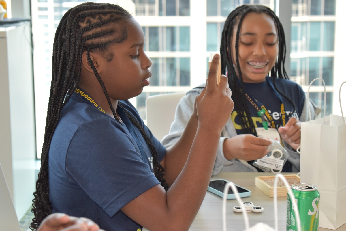 2 students participating in a STEM activity