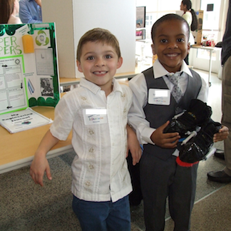 InVenture Prize - two students pose in front of their project