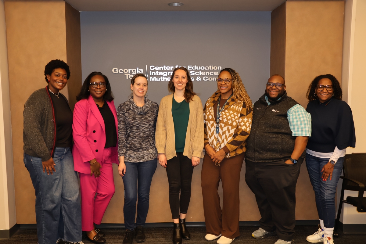 Kari Nimox, Patrice Holt, Melissa Fisher, Katherine King, Shameka Williams, Sirocus Barnes, and Adrian Neely posing for a photo.